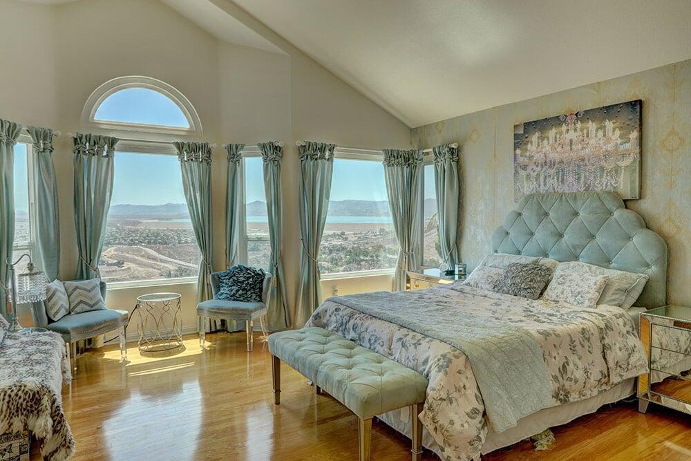 Bright living area with large windows showing a scenic mountain view in Riverside, California.